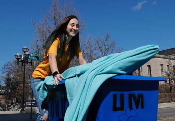 University of Michigan student moving into their dorm
